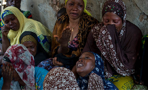 The mother (centre) of Idris Mavukiro (20), an opposition supporter killed this morning during a robbery, mourns the death of her son in Bujumbura, Burundi, on July 23, 2015. Since the crisis in Burundi began, there appears to have been a rise in robberies. Several people have been killed in armed robberies  in the capital over the past few weeks.