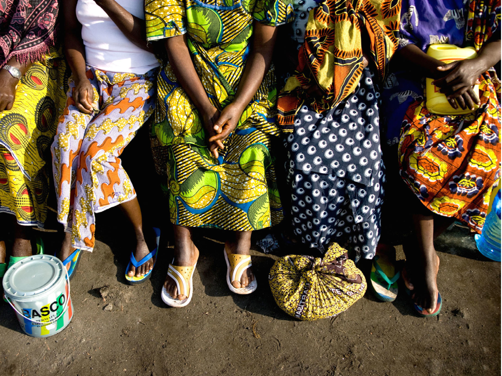 Women sit together outside their dormatory at the Heal Africa Transit Center for women victims of sexual violence. While these women have recieved humanitarian and medical assistance for their immediate needs after sexual violence, due to funding gaps they are unlikely to receive consistant humanitarian programming for prevention or reintegration. 