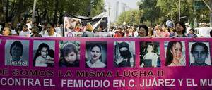 A group of women hold a banner with pictures of victims during a demonstration against violence to women in Mexico City, on November 29, 2008. Last November 25 the "Stop Violence Against Women" day was celebrated in Mexico. According to NGO's reports, in the last 18 months 1,014 women have been killed --most of them in domestic violence cases. AFP PHOTO/Alfredo Estrella (Photo credit should read ALFREDO ESTRELLA/AFP/Getty Images)