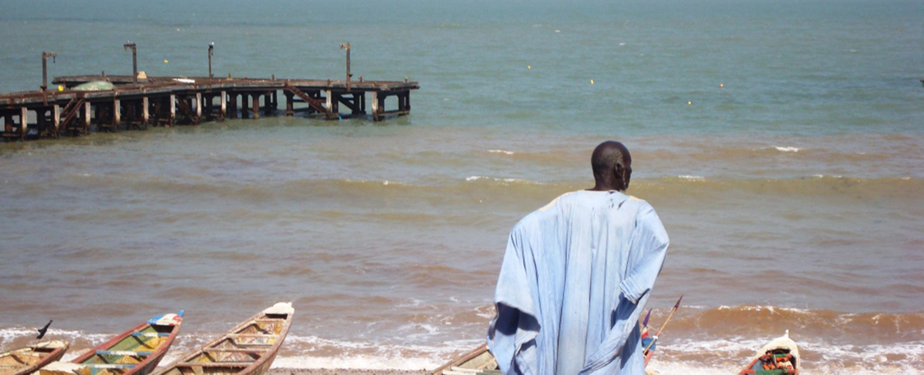 Man facing the sea in Gambia. CC_Steve Wheeler