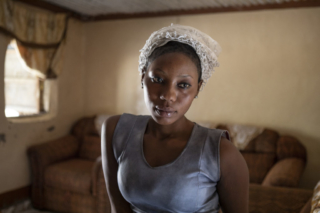 On May 9th 2016 Amie Bayo, a nursary school teacher and daughter of Kafo Bayo a UDP party activist, went to protest her husband’s disappearance after being arrested on April 14th 2016 during a peaceful protest. But Adja was arrested along with her mother Adja Bayo by President Yahya Jammeh’s security forces. She was detained for ten days at the National Intelligence Agency and subjected to physical abuse. © Jason Florio / TRIAL International