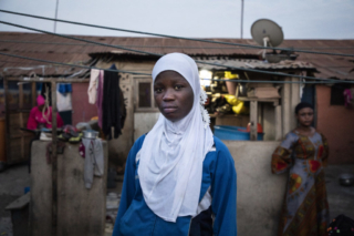 Ayesha Kassim, daughter of murdered Ghanaian migrant Abaley Kassim. She was only one year old when her father was killed along 56 west Africa migrants in The Gambia by Jammeh's security forces. ©Jason Florio / TRIAL International