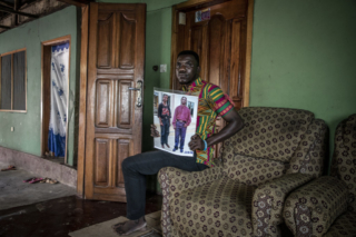 Hisford Achempong, son of murdered Ghanaian migrant Enoch Amo. His father was killed along with 56 West Africa migrants in The Gambia by Jammeh's security forces in 2005. © Jason Florio / TRIAL International